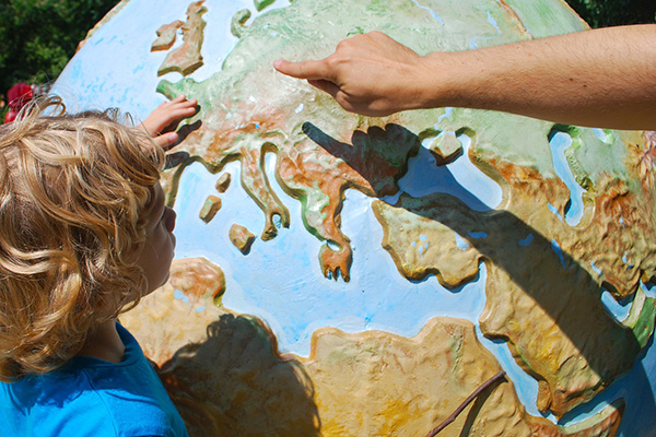 Adult shows child the world